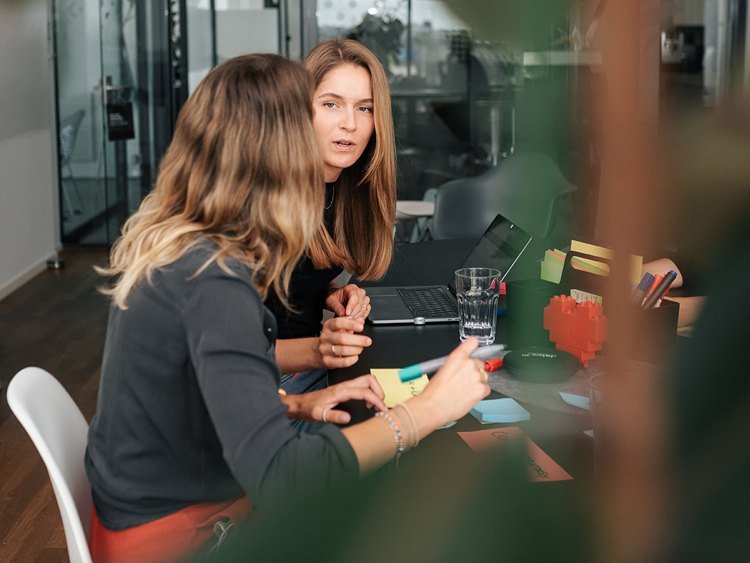 Two women sitting together having a conversation