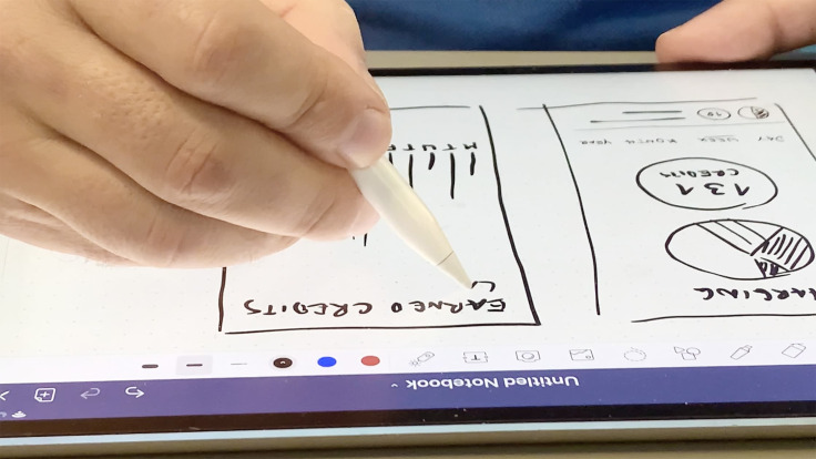 someone draws on a tablet